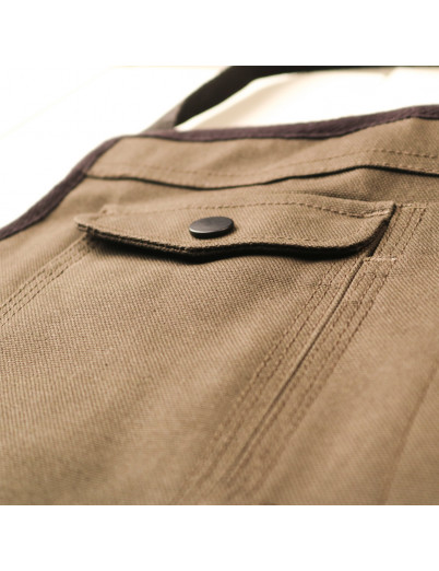 Delantal con múltiples espacios para guardar las herramientas de peluquería